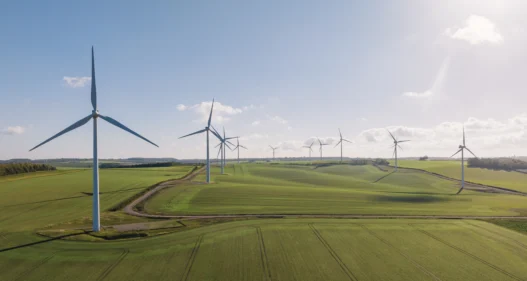Drone view of a wind farm. Multiple wind turbines. A sunny day. - stock photo