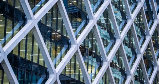 Office building facade at night - stock photo