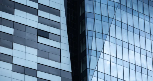 Modern Glass Facade with Black-and-White Panel Elements in Downtown - stock photo