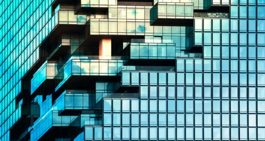 Angle view of modern building with a clear blue sky in background - stock photo