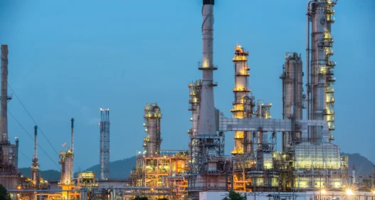 Oil and gas refinery industry Factory at sunset - stock photo