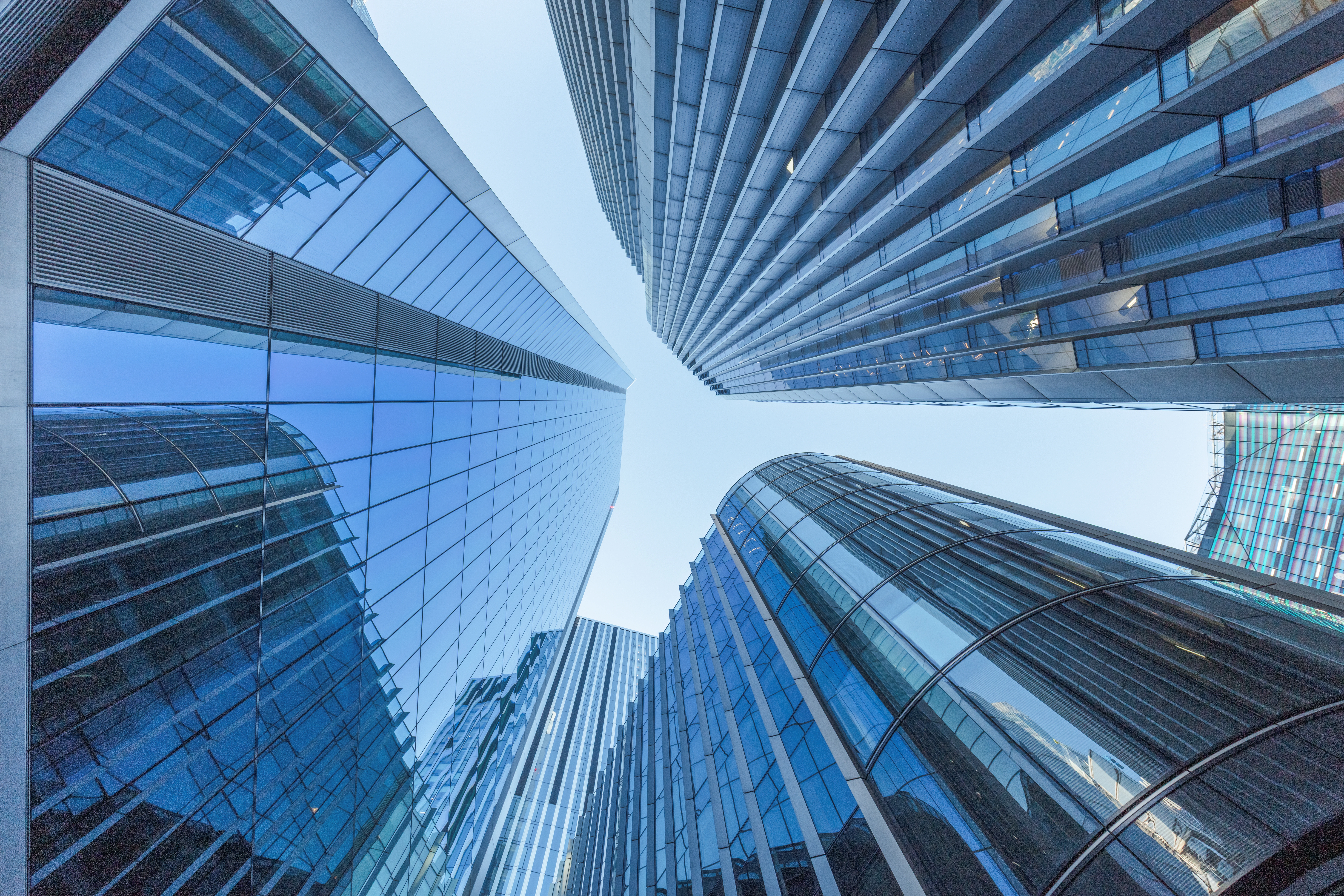 Looking up at corporate buildings in City of London - stock photo