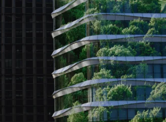 Double exposure of lush green forest and modern office building facade representing sustainable urban architecture - stock photo
